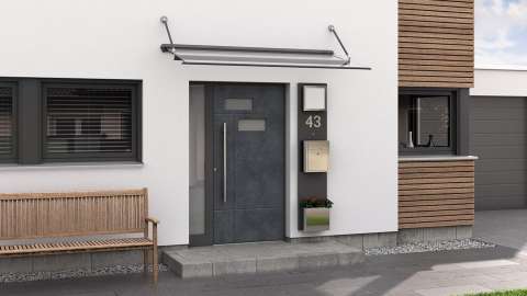 graue Kompotherm-Haustür mit Vordach in einem modernen Haus