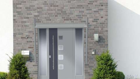 graues Vordach über grauer Haustür in grauem Klinker