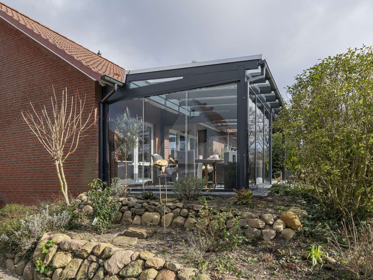 Außenansicht kombiniertes Pultdach Glashaus und Terrassendach in Stelle